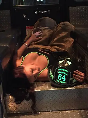 woman lying inside a fire truck